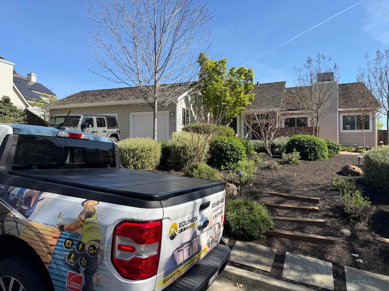 Residential roof being inspected for sagging areas